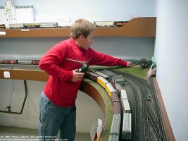 Mike stretches to throw a switch